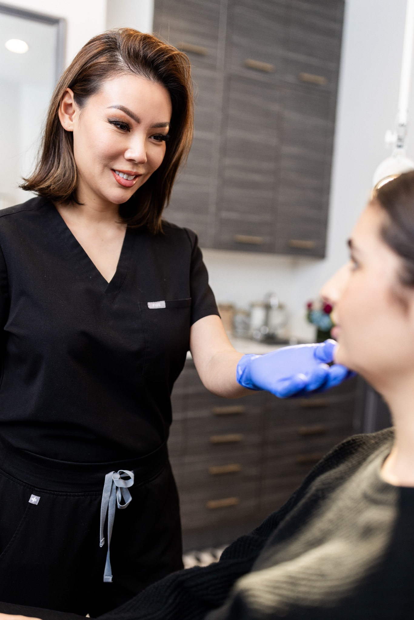 Clinician consulting with patient about non-surgical rhinoplasty treatment in Beverly Hills