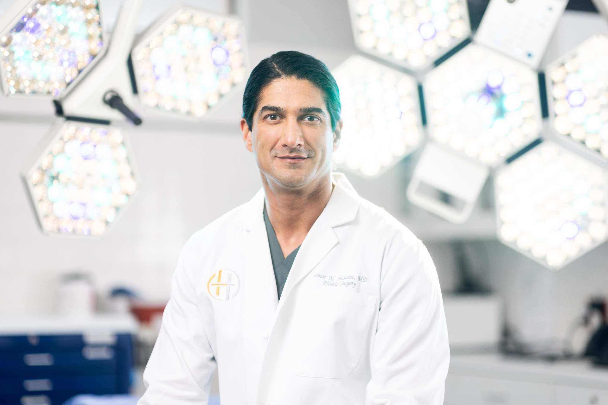 Dr. Omar Hussain, Beverly Hills rhinoplasty specialist in operating room