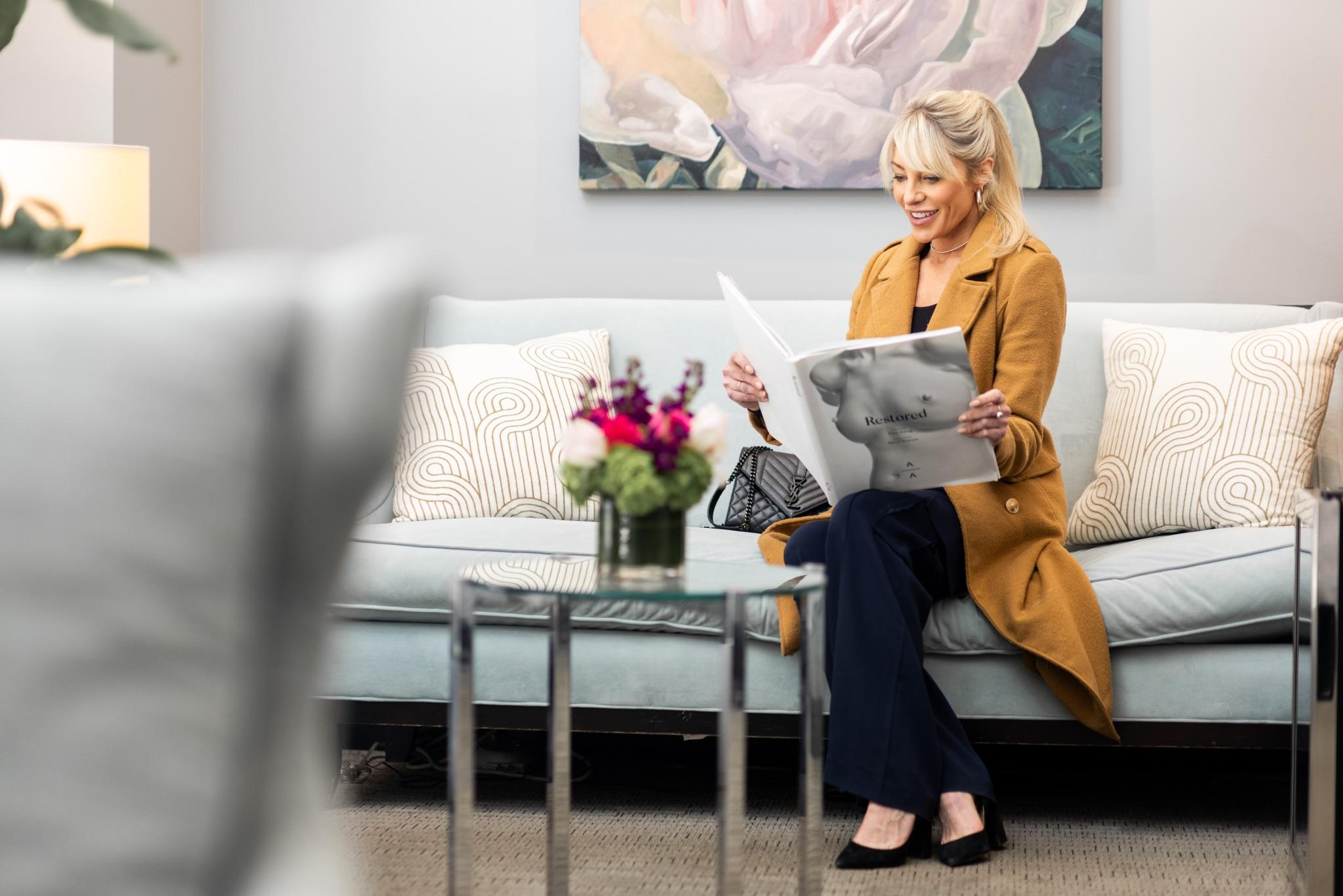 Patient reviewing breast surgery information in the practice waiting room