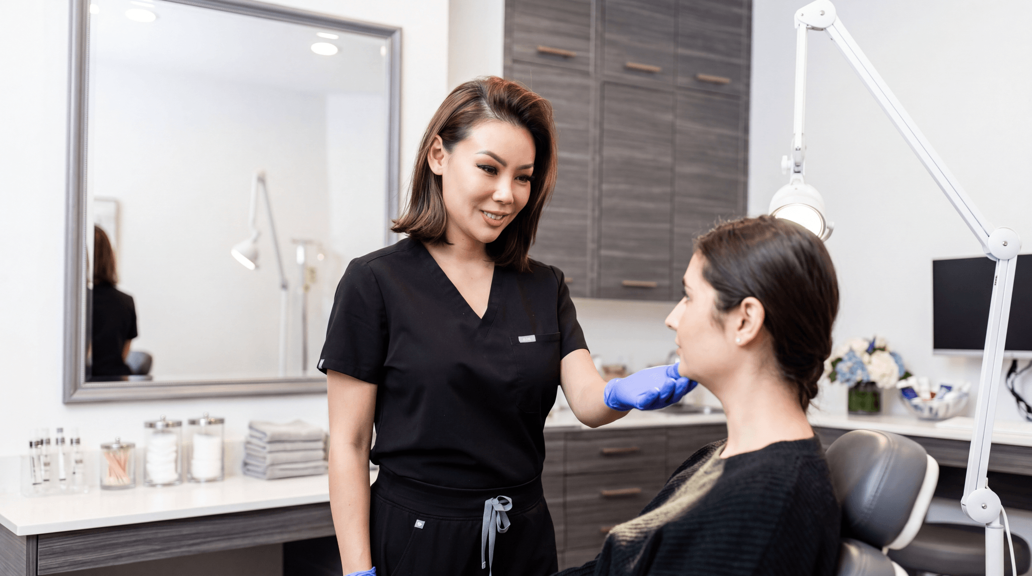Provider performing a skin assessment before a chemical peel treatment at The Practice Healthcare Medspa, Beverly Hills