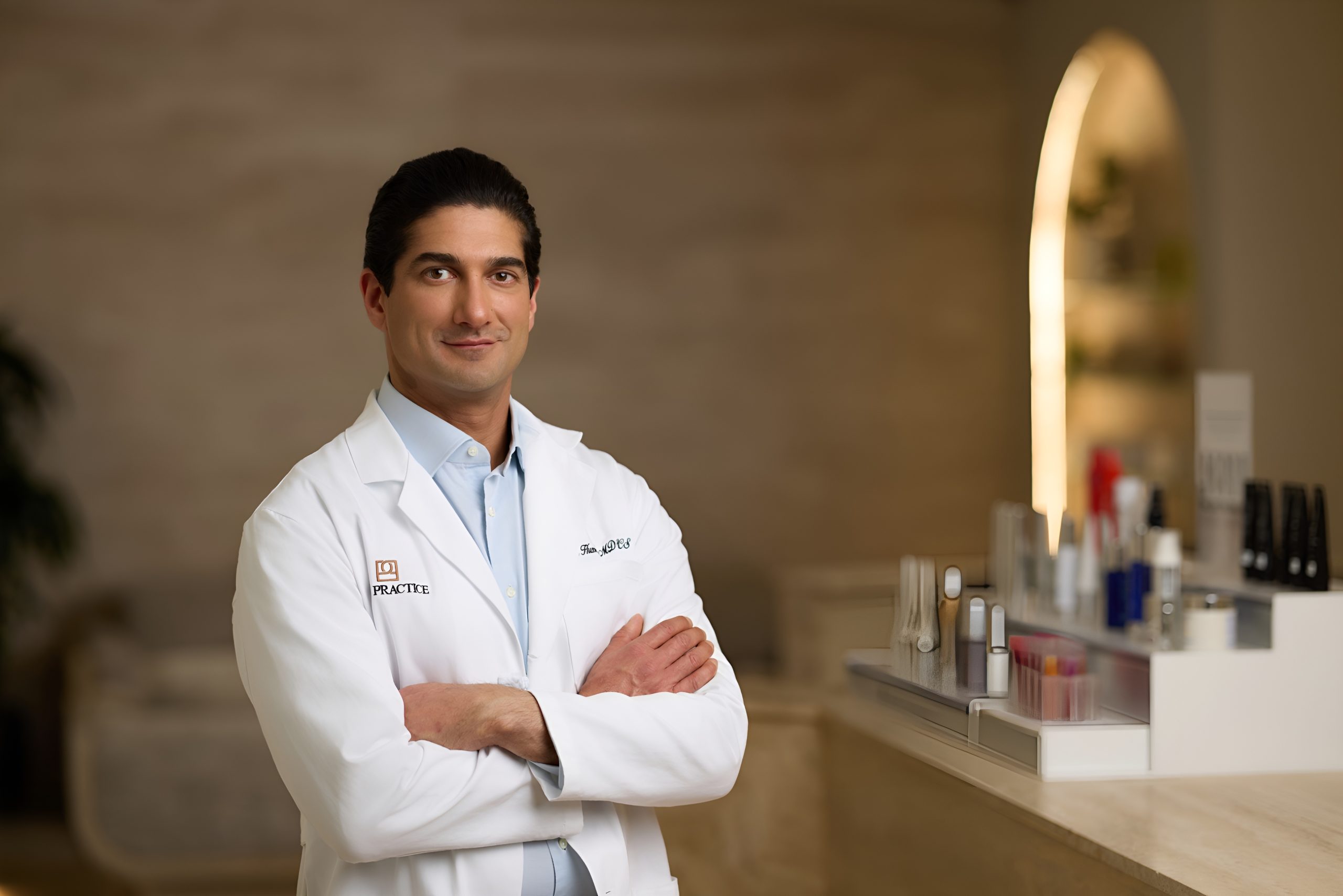 Choosing a board-certified facelift surgeon Portrait of a board-certified facelift surgeon in a white coat, representing the credentials and clinical authority that define a top-tier specialist.
