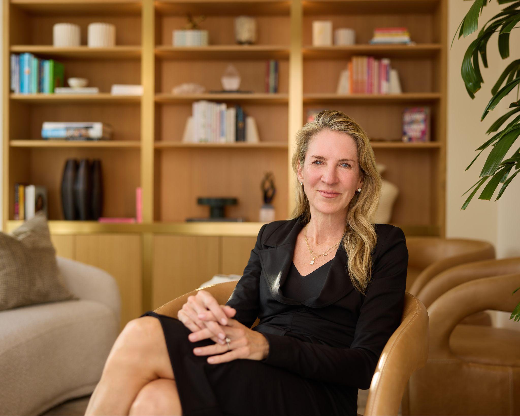 Dr. Lisa Cassileth seated in the consultation lounge, where she reviews reconstruction and revision options with patients.